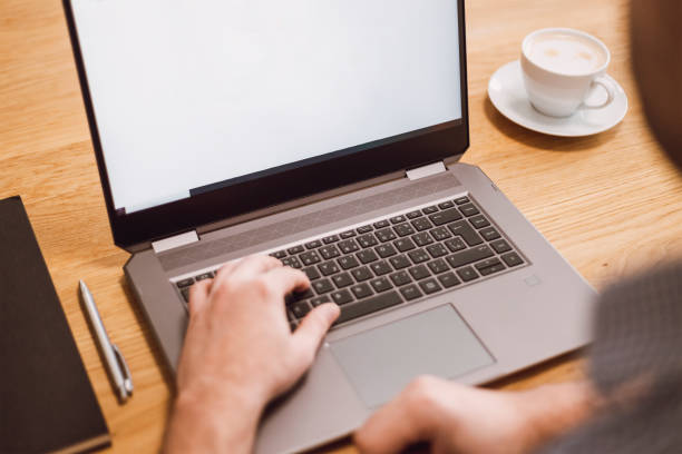 istock Man working remotely on laptop. Businessman working from home during pandemic 1302649130