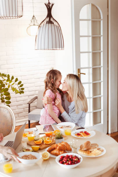 istock Mother and daughter bonding over breakfast 1302650831