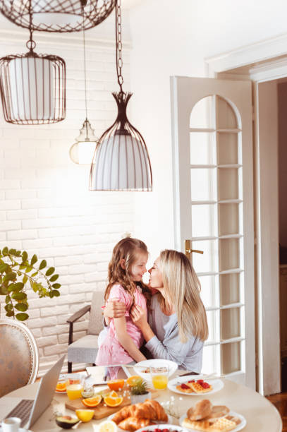 istock Mother and daughter bonding over breakfast 1302651028