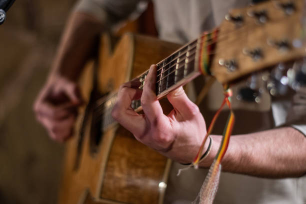istock Hippie strumming an acoustic guitar 1302652273