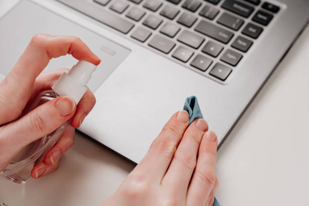 istock laptop's keyboard is treated with antiseptic spray or electronics cleaning agent 1302652584