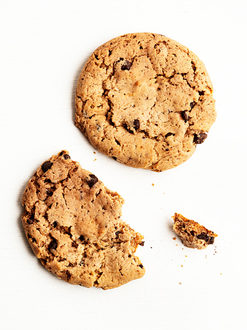 Different chocolate chip and oat cookies isolated on white background.