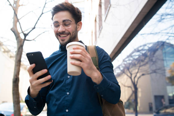istock Young man using his mobile phone outdoors. 1302653956