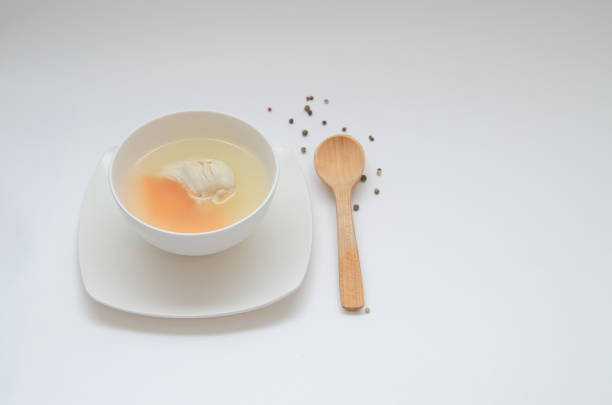 istock Diet chicken broth in a white bowl 1302654108