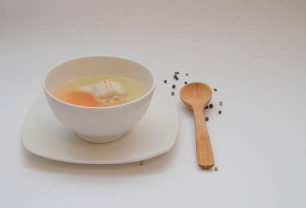 istock Diet chicken broth in a white bowl 1302654132
