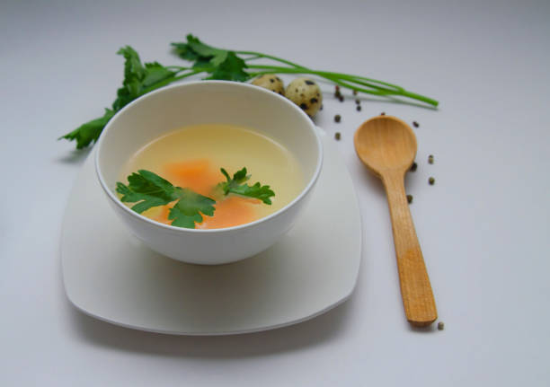 istock Diet chicken broth in a white bowl 1302654210