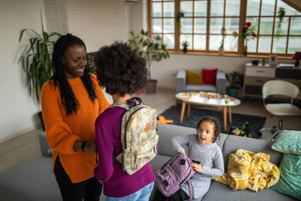 istock Mother making sure that everything is fine before her daughter go to school 1302654745