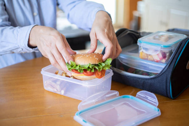istock Woman preparing lunch food 1302655847