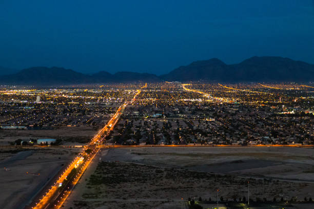 istock Illuminated urban sprawl at dusk 1302655910
