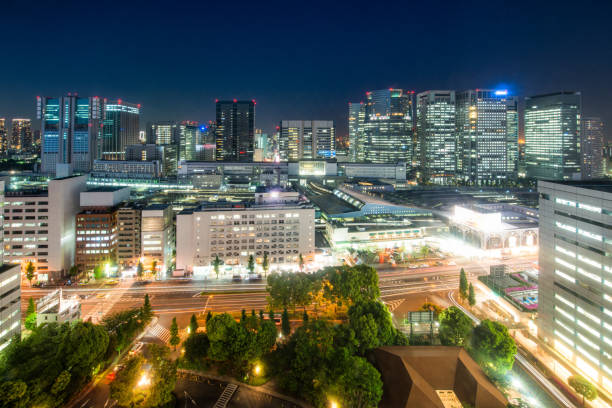 istock Illuminated city skyline at dusk 1302656701