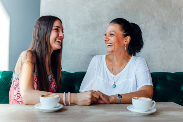 istock Two Happy Women In A Cafe 1302657415