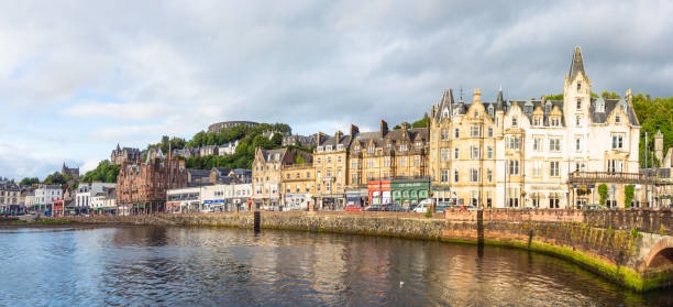 Oban waterfront panorama A panoramic view of the town of Oban on Scotland's west coast. oban stock pictures, royalty-free photos & images