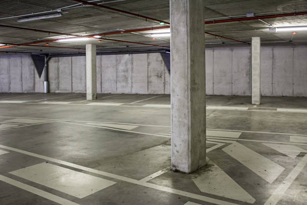 istock Interior of an empty parking for cars 1302659737