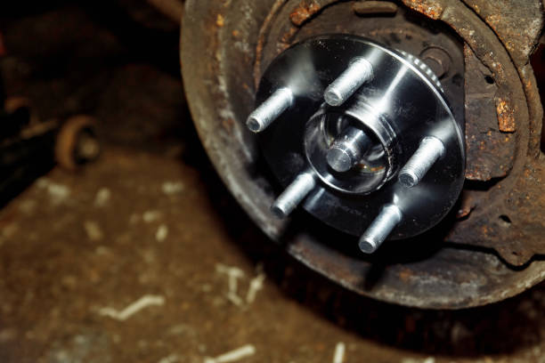 istock car wheel hub replacement in garage 1302661499
