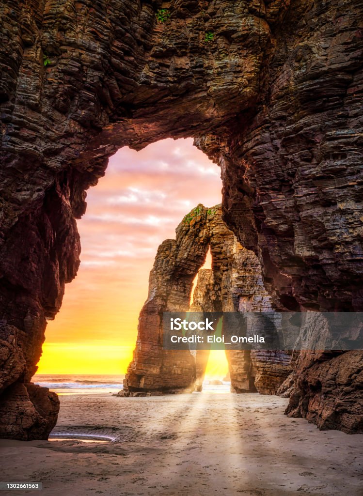 Playa de las Catedrales Cathedral beach in Galicia Spain Natural rock arches in an Idyllic sunrise landscape in Cathedrals beach (playa de las catedrales), Ribadeo, Galicia, Spain Beach Stock Photo