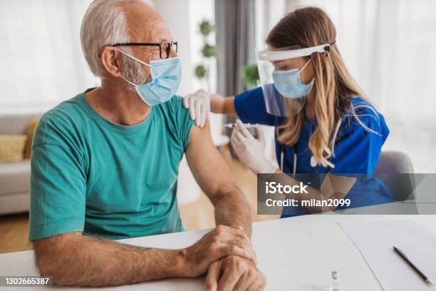 Visiting The Doctor Stock Photo - Download Image Now - 18-19 Years, 65-69 Years, Adult