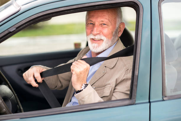 istock Senior man putting seat belt in the car 1302666039