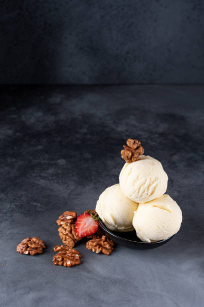 istock Ice cream with strawberries and walnuts 1302668698