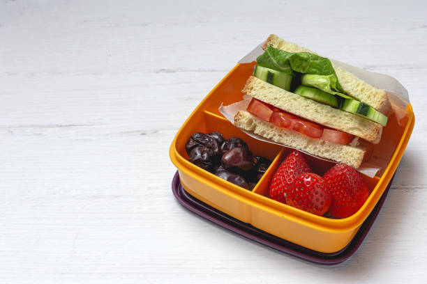 istock Sandwich in plastic container on wooden background 1302668957