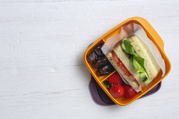 istock Sandwich in plastic container on wooden background 1302668975