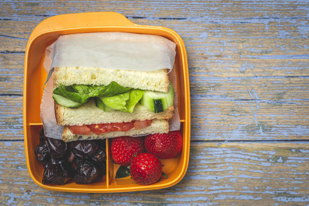 istock Sandwich in plastic container on wooden background 1302668994