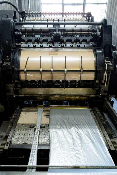 istock Offset printing machine feeder transfer metallic paper through the feeding table to the printing unit 1302669245