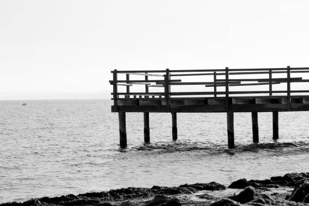 Old wooden pier on the shore in Santa Pola, Alicante, Spain