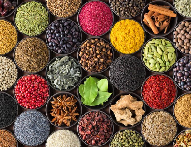 istock bright Indian spices and herbs in cups, top view. background for packing with condiments. 1302670464