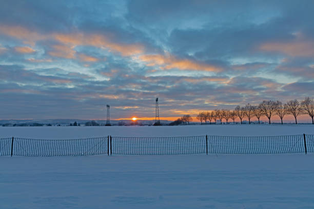 istock snow fence in sunset 1302671670