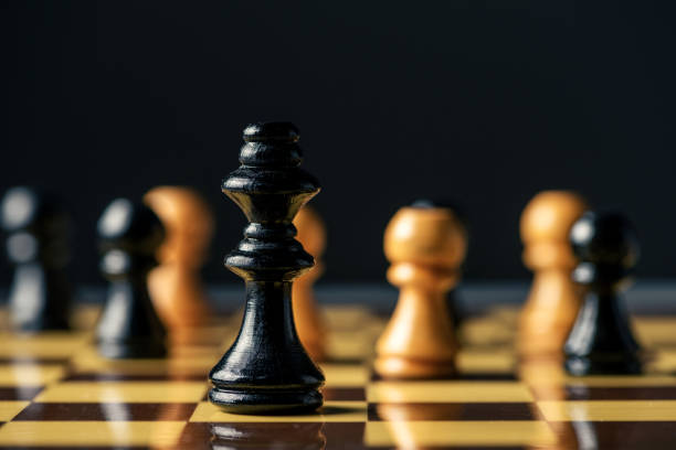 istock Horses face to face in chess. Chess concept 1302671892