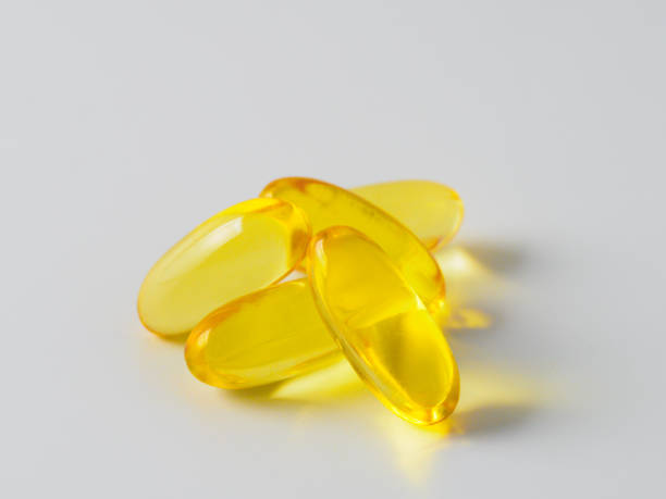 istock Omega 3 fish oil capsules isolated on white 1302673391
