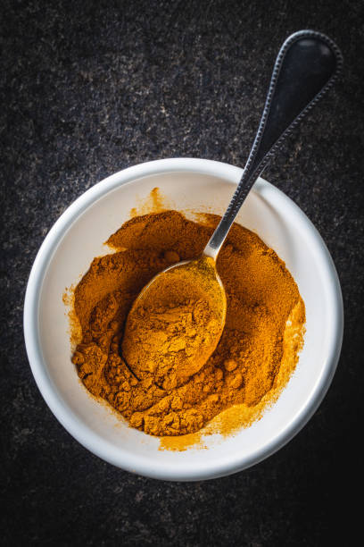 istock Indian turmeric powder. Turmeric spice. Ground turmeric. 1302675502