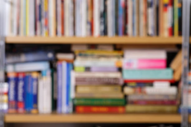 istock Defocused shelves with books colorful background 1302675844