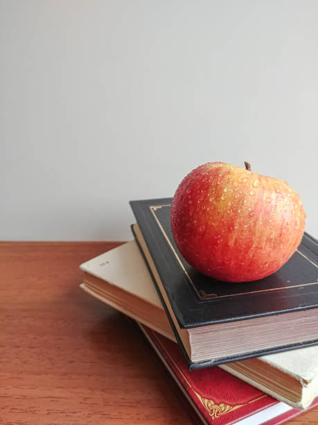 istock Stack of books and apple on top 1302676694