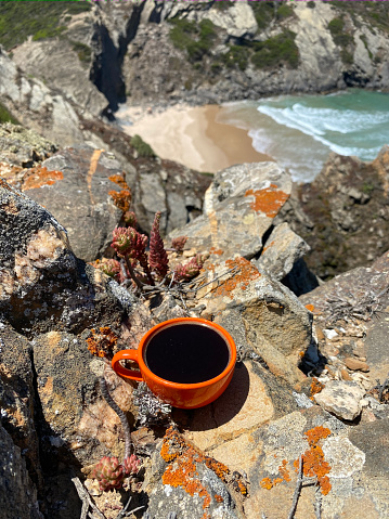 a cup of coffee overlooking the atlantic ocean in Odeceixe, Faro District, Portugal