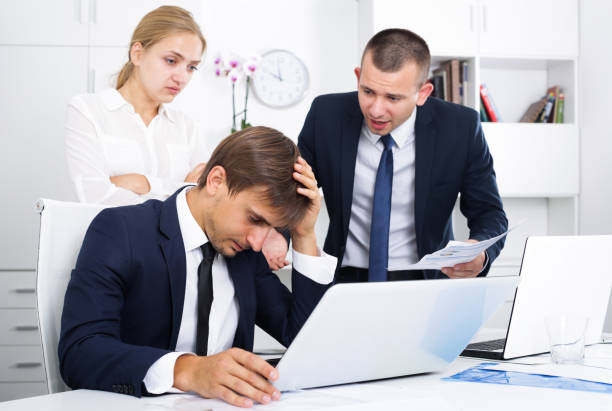 istock three depressed business colleagues in office 1302679762