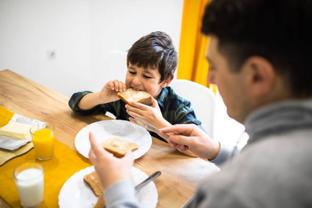 istock A cute boy biting into a piece of toast 1302680143