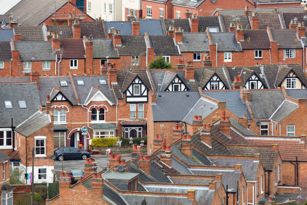 Rows of suburban terraced houses Warwick UK Rows of old suburban terraced houses in an English town. Warwick, UK midlands england stock pictures, royalty-free photos & images