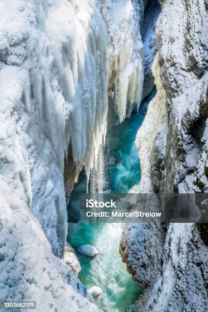 Partnachklamm Gorge In Winter Frozen Waterfalls Over Blue Water Stock Photo - Download Image Now