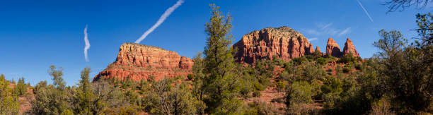 Panoramic image of the rock formations and vegetation found on the hiking trails in Sedona, Arizona.