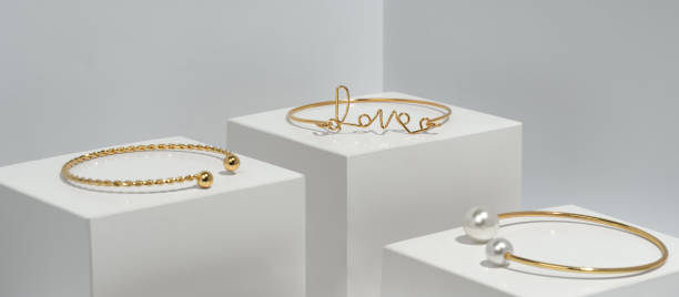 istock Love word shape and pearls bracelets on white boxes 1302683557