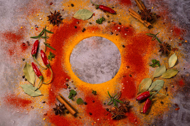 istock Assorted variety of spices on a dark background with laurel leaves. Free space for text inside.Copy space. 1302683980