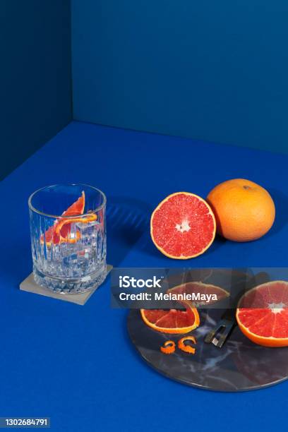 Pop Art Style Gin Cocktail With Grapefruit Citrus Fruit In Blue Background Stock Photo - Download Image Now
