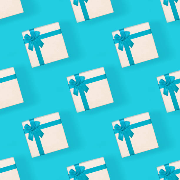 istock seamless pattern in the form of a blue background with gift boxes. Background 1302686821