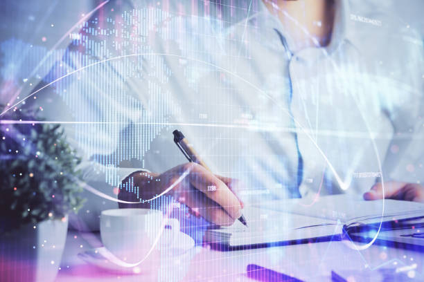 istock Double exposure of hands and notepad with business icons. 1302686863