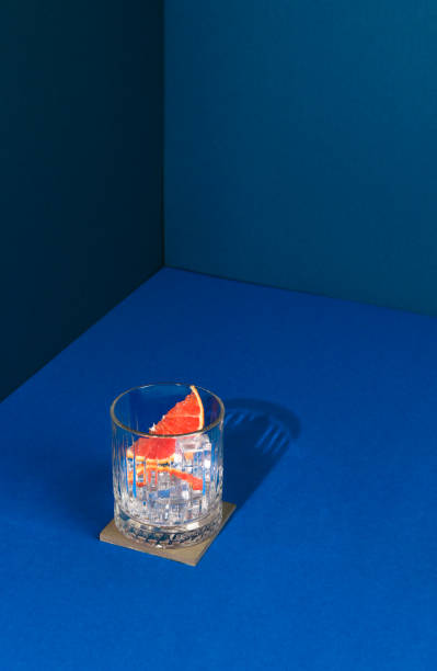 Pop Art Style Gin cocktail with Grapefruit Citrus Fruit in blue Background