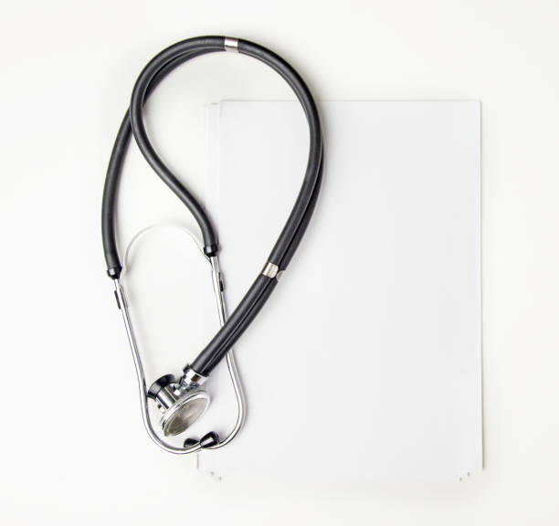 istock Stethoscope on album sheet on white table 1302687102