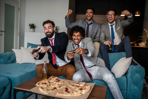 istock A group of young business man playing video games after work 1302687906
