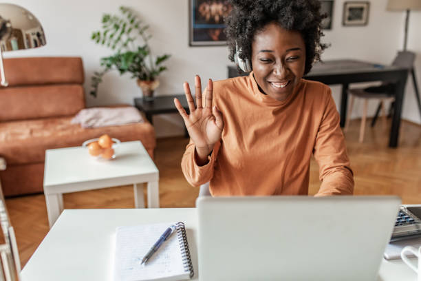 istock Young African American woman working from home 1302688544