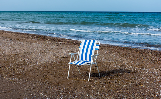 Two empty deck chairs on brighton Beach, on a sunny summer's day